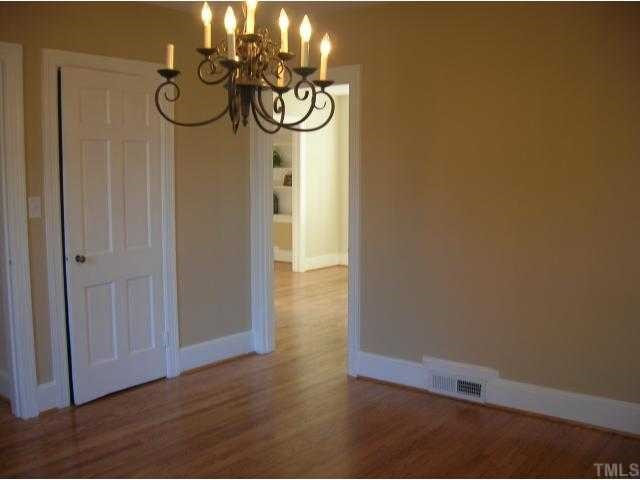 127 Brooks Avenue Raleigh, NC 27607 - Photo 7 of 11 Large dining room perfect for entertaining. Or, replace the doors (stored in attic) and this becomes a 1st floor bedroom!
