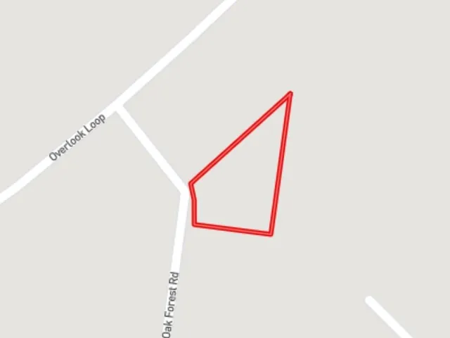 a street sign that is on a rock