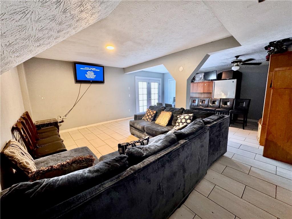 1825 North Road Snellville, GA 30078 - Photo 12 of 43 a living room with furniture and a flat screen tv