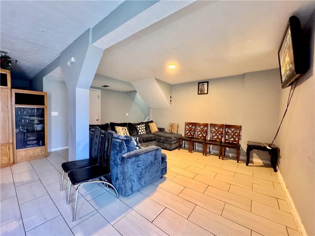 1825 North Road Snellville, GA 30078 - Photo 15 of 43 a living room with furniture and a flat screen tv