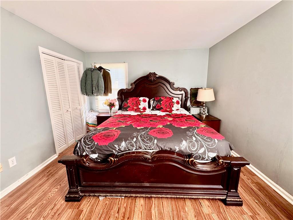 1825 North Road Snellville, GA 30078 - Photo 18 of 43 a bedroom with a bed and a chandelier