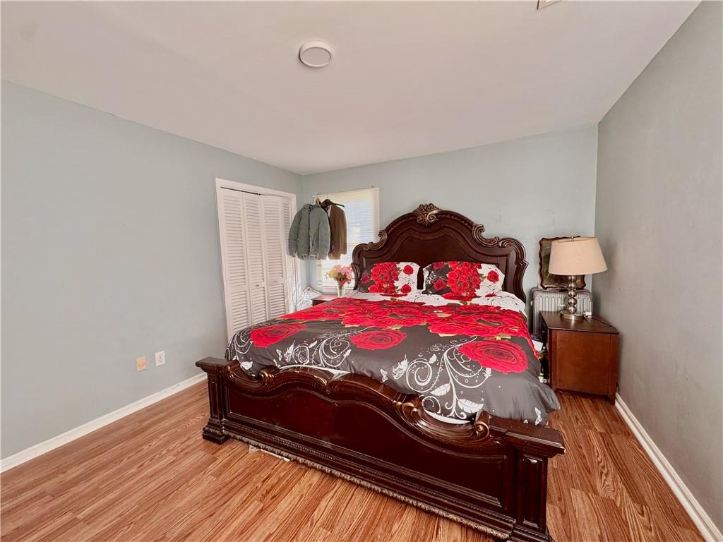 1825 North Road Snellville, GA 30078 - Photo 19 of 43 a bedroom with a bed and wooden floor