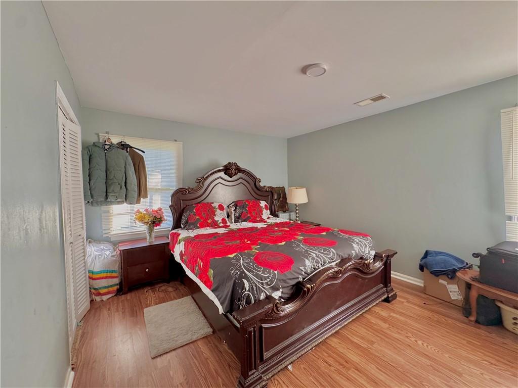 1825 North Road Snellville, GA 30078 - Photo 20 of 43 a bedroom with a bed and wooden floor