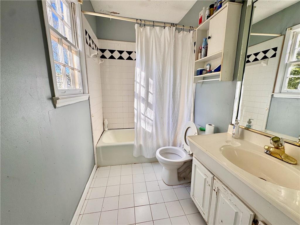 1825 North Road Snellville, GA 30078 - Photo 21 of 43 a bathroom with a sink toilet and shower