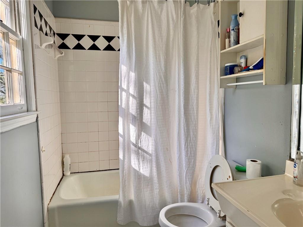 1825 North Road Snellville, GA 30078 - Photo 22 of 43 a bathroom with a sink toilet and shower