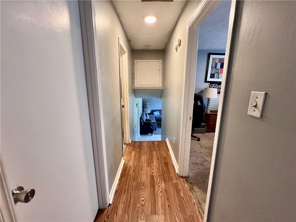 1825 North Road Snellville, GA 30078 - Photo 23 of 43 a view of a hallway with wooden floor and closet