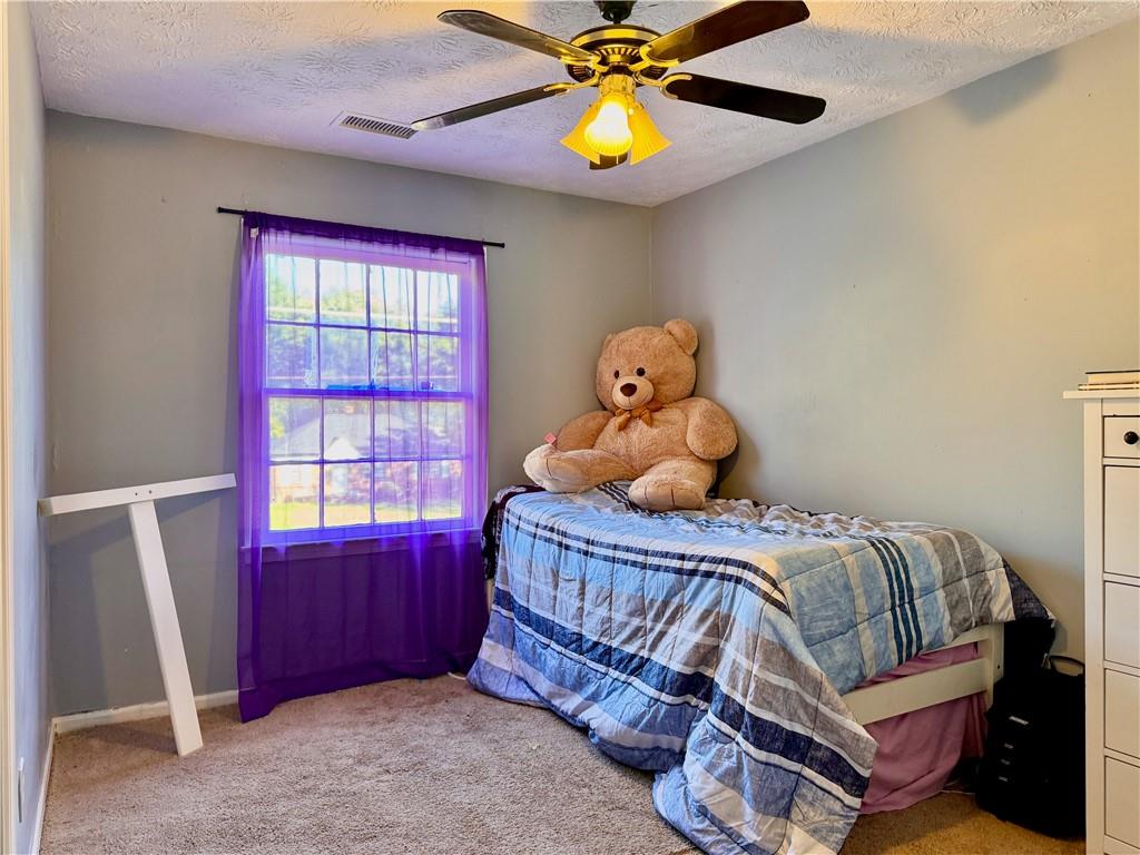 1825 North Road Snellville, GA 30078 - Photo 24 of 43 a bedroom with a bed and a window