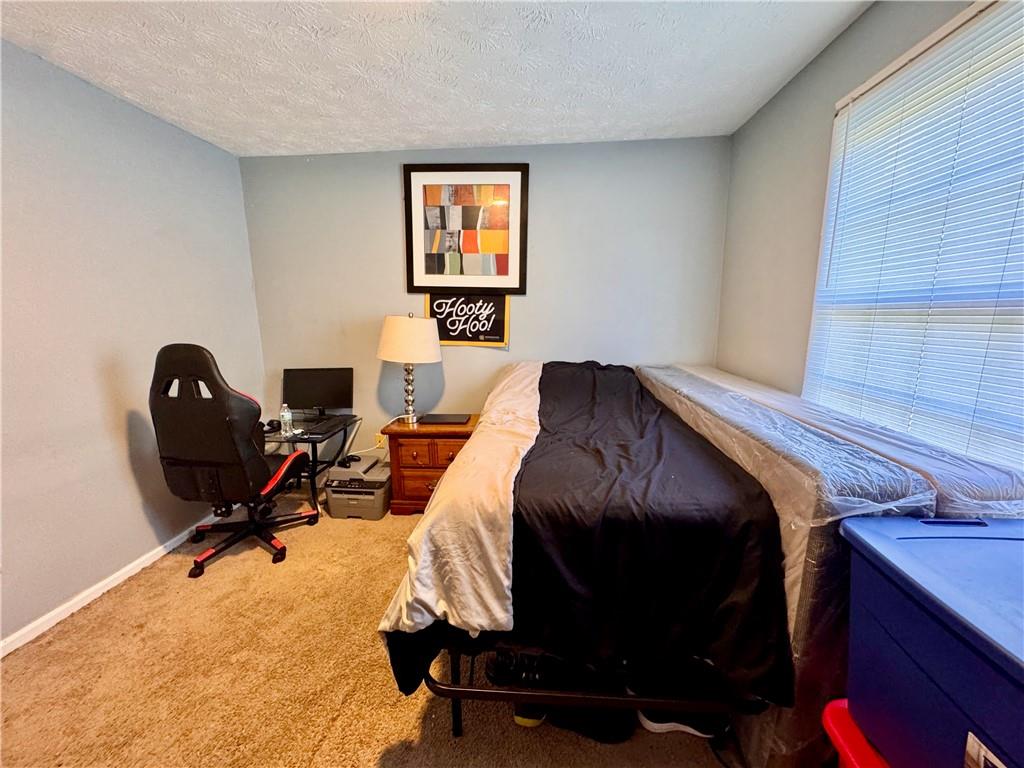 1825 North Road Snellville, GA 30078 - Photo 27 of 43 a bedroom with a workspace