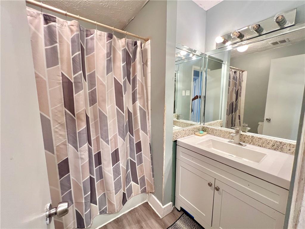 1825 North Road Snellville, GA 30078 - Photo 28 of 43 a bathroom with a sink and a mirror