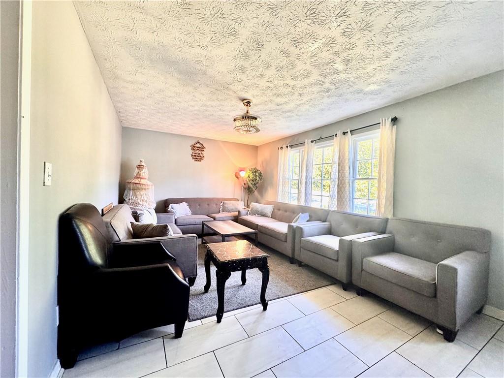 1825 North Road Snellville, GA 30078 - Photo 3 of 43 a living room with furniture and a large window