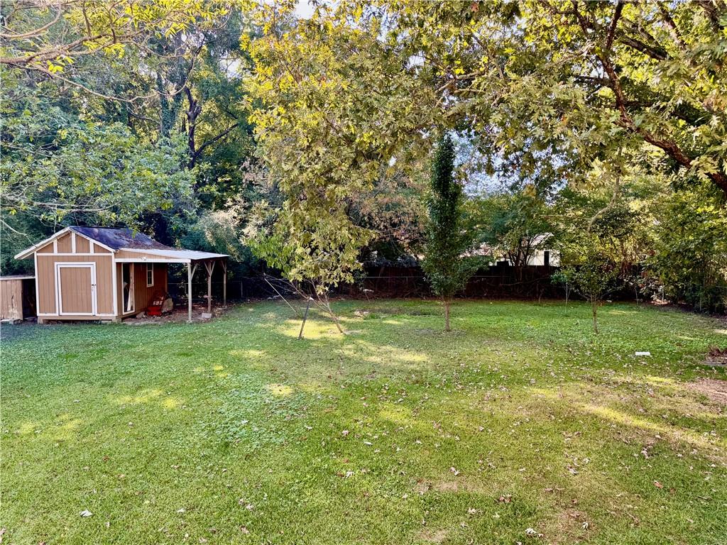1825 North Road Snellville, GA 30078 - Photo 32 of 43 a view of a house with a backyard