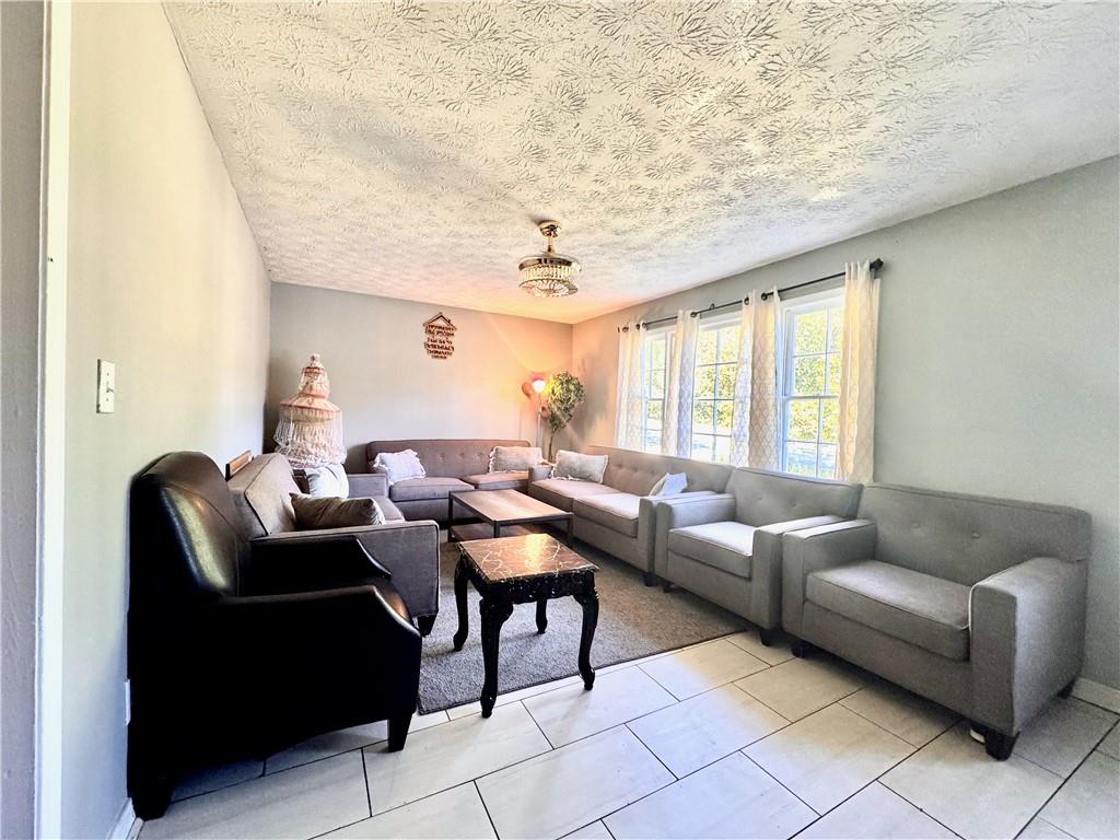 1825 North Road Snellville, GA 30078 - Photo 4 of 43 a living room with furniture and a large window