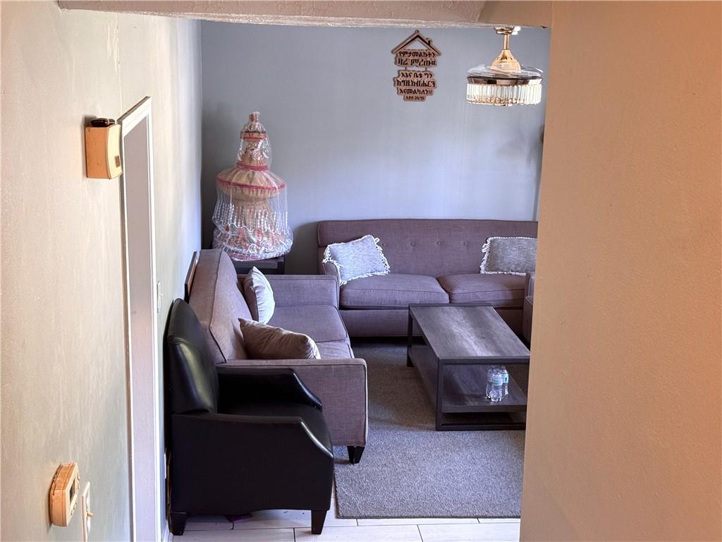 1825 North Road Snellville, GA 30078 - Photo 41 of 43 a living room with furniture and a couch