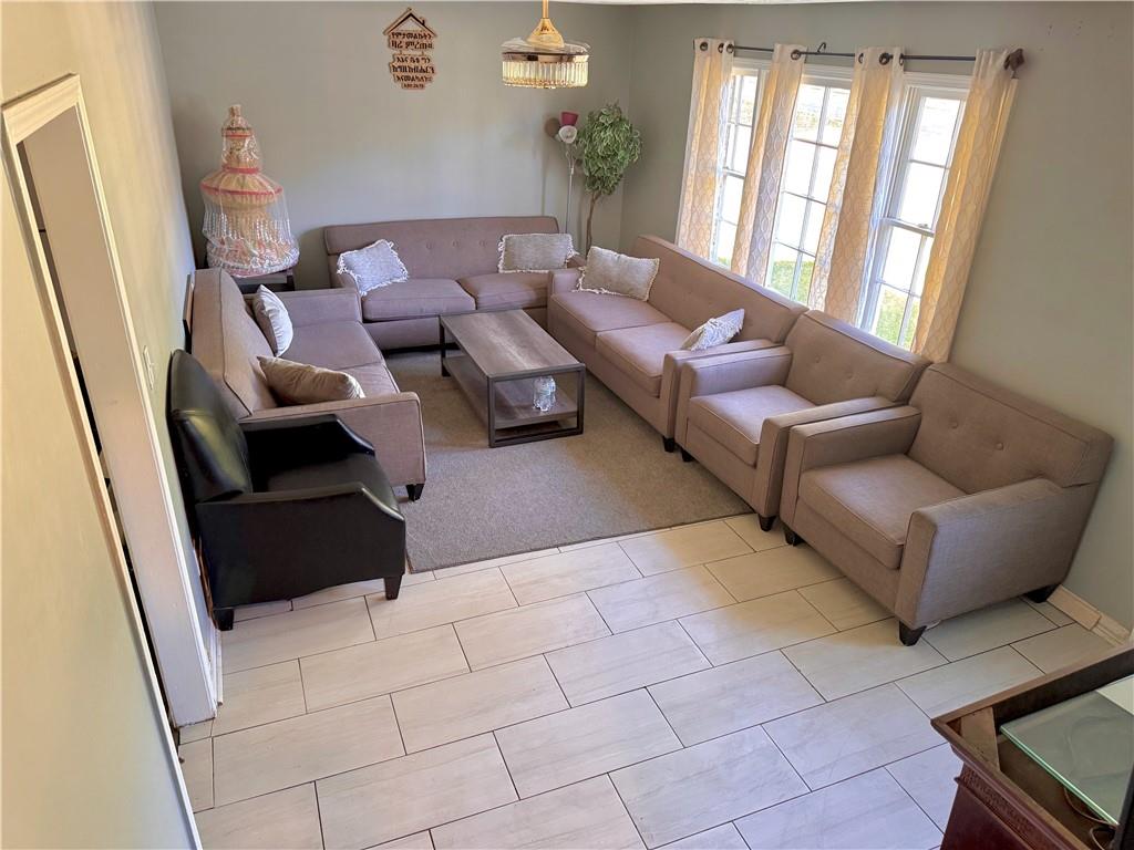 1825 North Road Snellville, GA 30078 - Photo 42 of 43 a living room with furniture and a potted plant