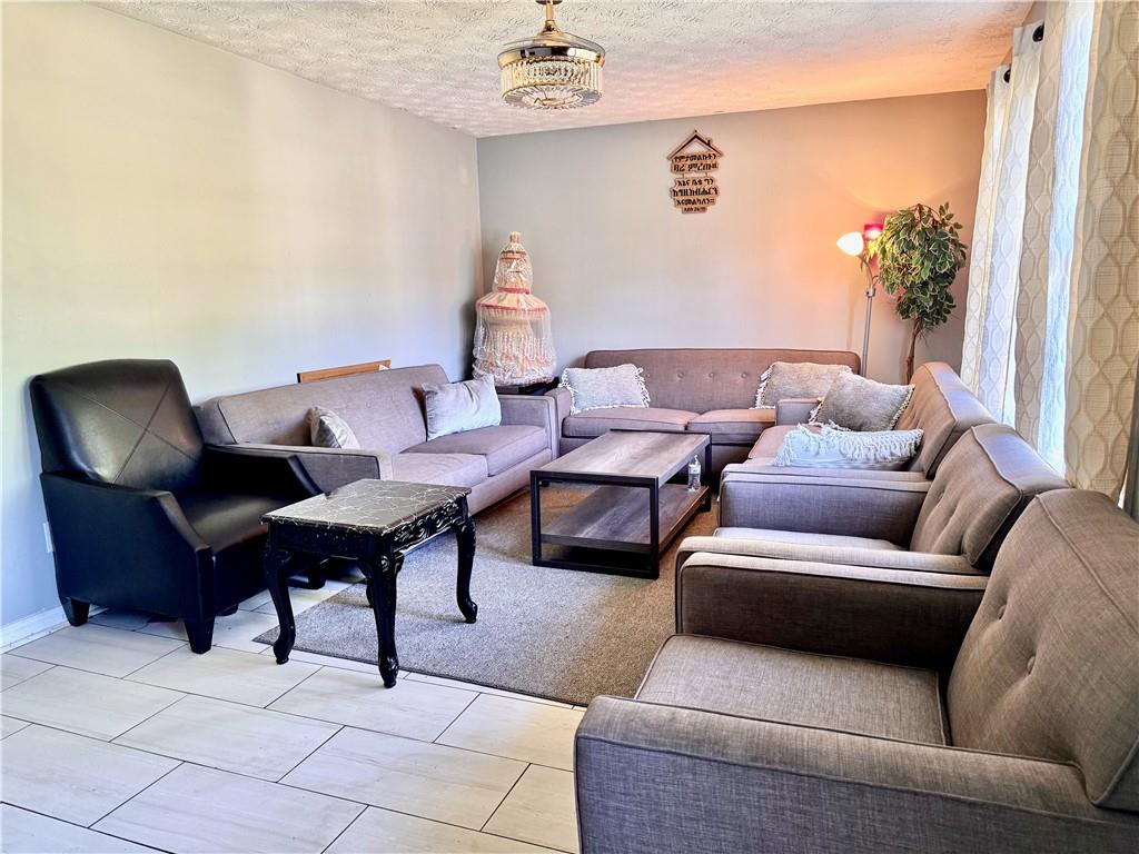 1825 North Road Snellville, GA 30078 - Photo 43 of 43 a living room with furniture and a potted plant