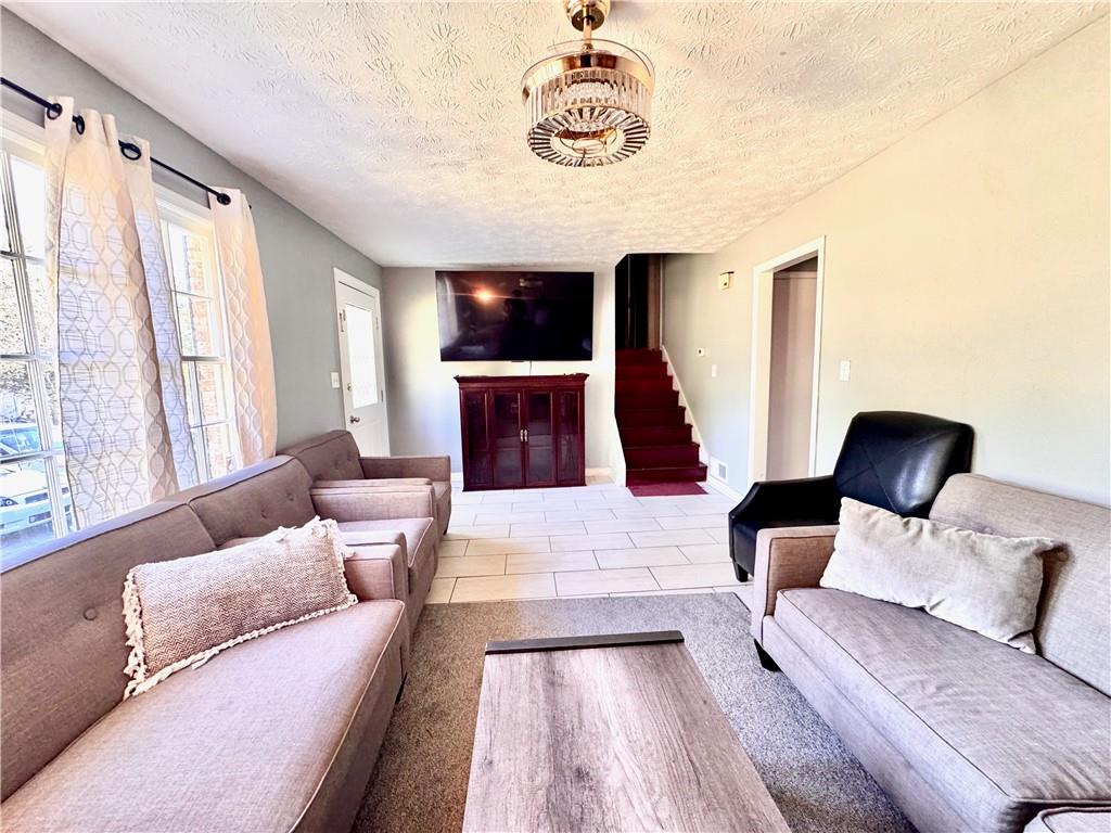 1825 North Road Snellville, GA 30078 - Photo 5 of 43 a living room with furniture and a large window