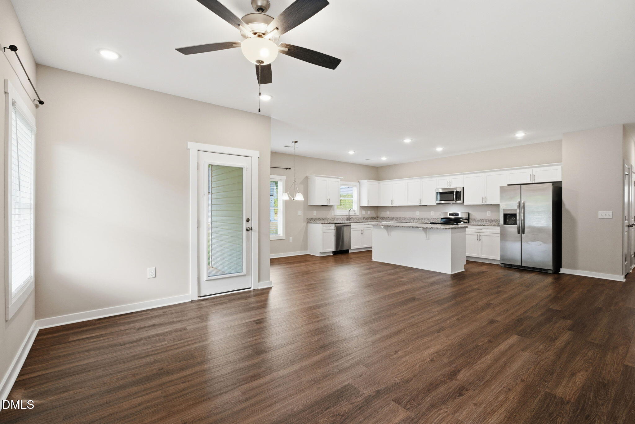 161 Tupelo Dr Spring Spring Hope, NC 27882 - Photo 13 of 28 a view of kitchen with wooden floor and window