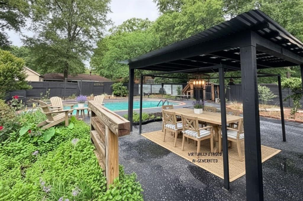 211 Chimney Lane Haughton, LA 71037 - Photo 29 of 35 a view of a patio with table and chairs under an umbrella