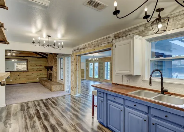 a kitchen with sink and cabinets