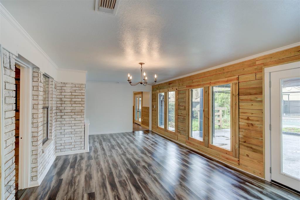 211 Chimney Lane Haughton, LA 71037 - Photo 9 of 35 a view of an empty room with wooden floor and a window