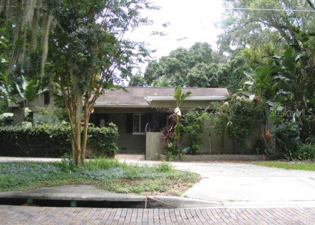 1812 Curry Ford Road Orlando, FL 32806 - Photo 1 of 1 a front view of house with a garden