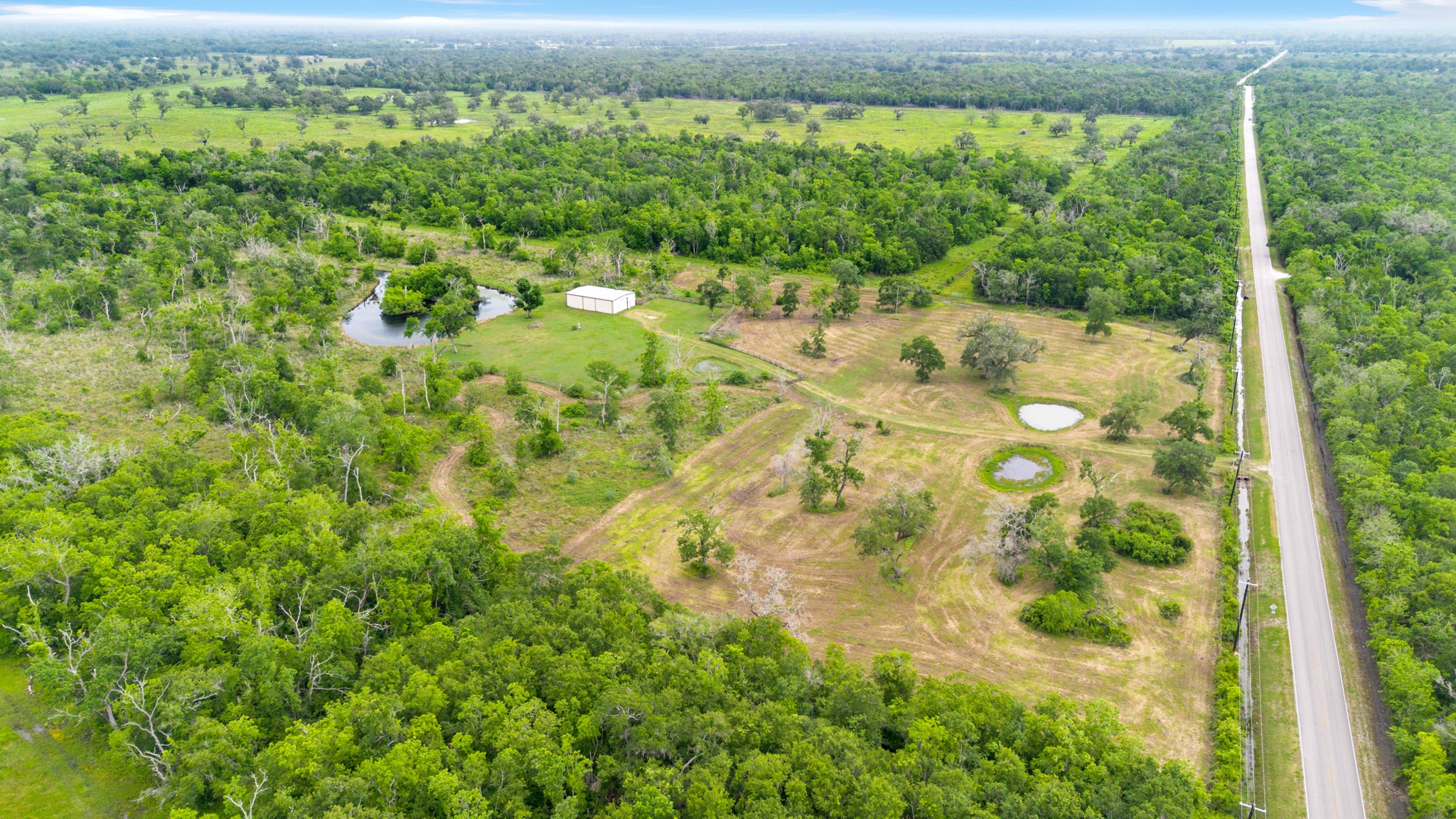 14067 County Road 809 Sweeny, TX 77480 - Photo 2 of 12 a view of a yard with an outdoor seating