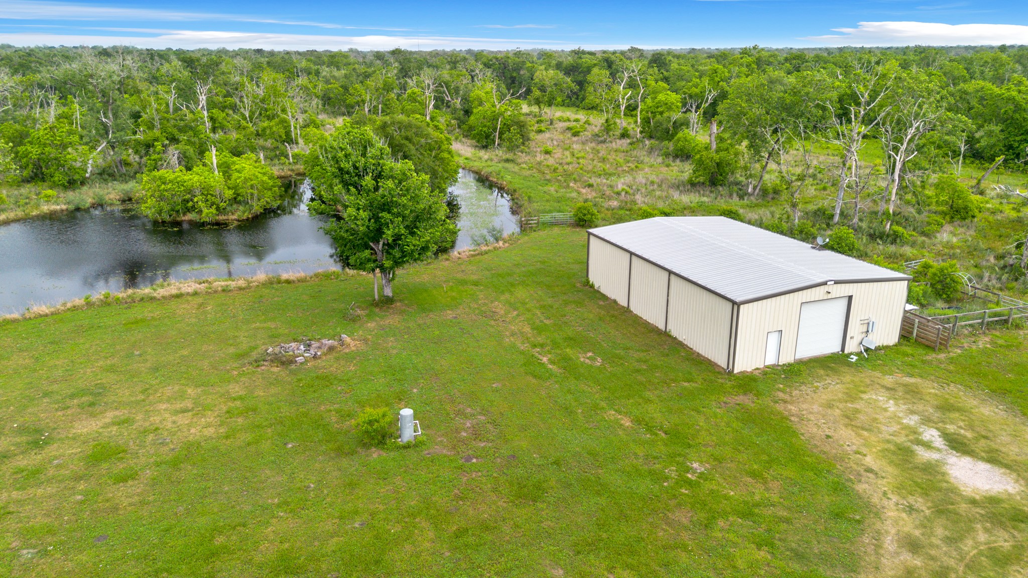 14067 County Road 809 Sweeny, TX 77480 - Photo 5 of 12 a view of a backyard with a garden