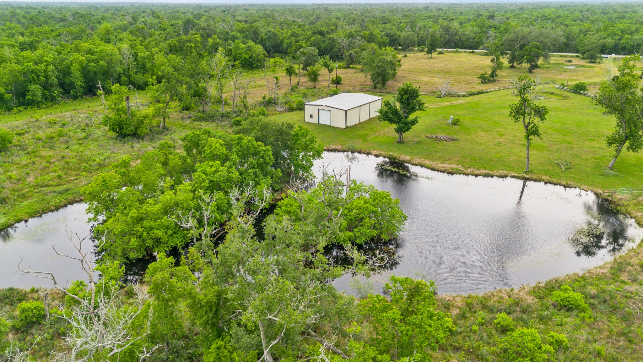 14067 County Road 809 Sweeny, TX 77480 - Photo 6 of 12 an aerial view of a houses with a lake view
