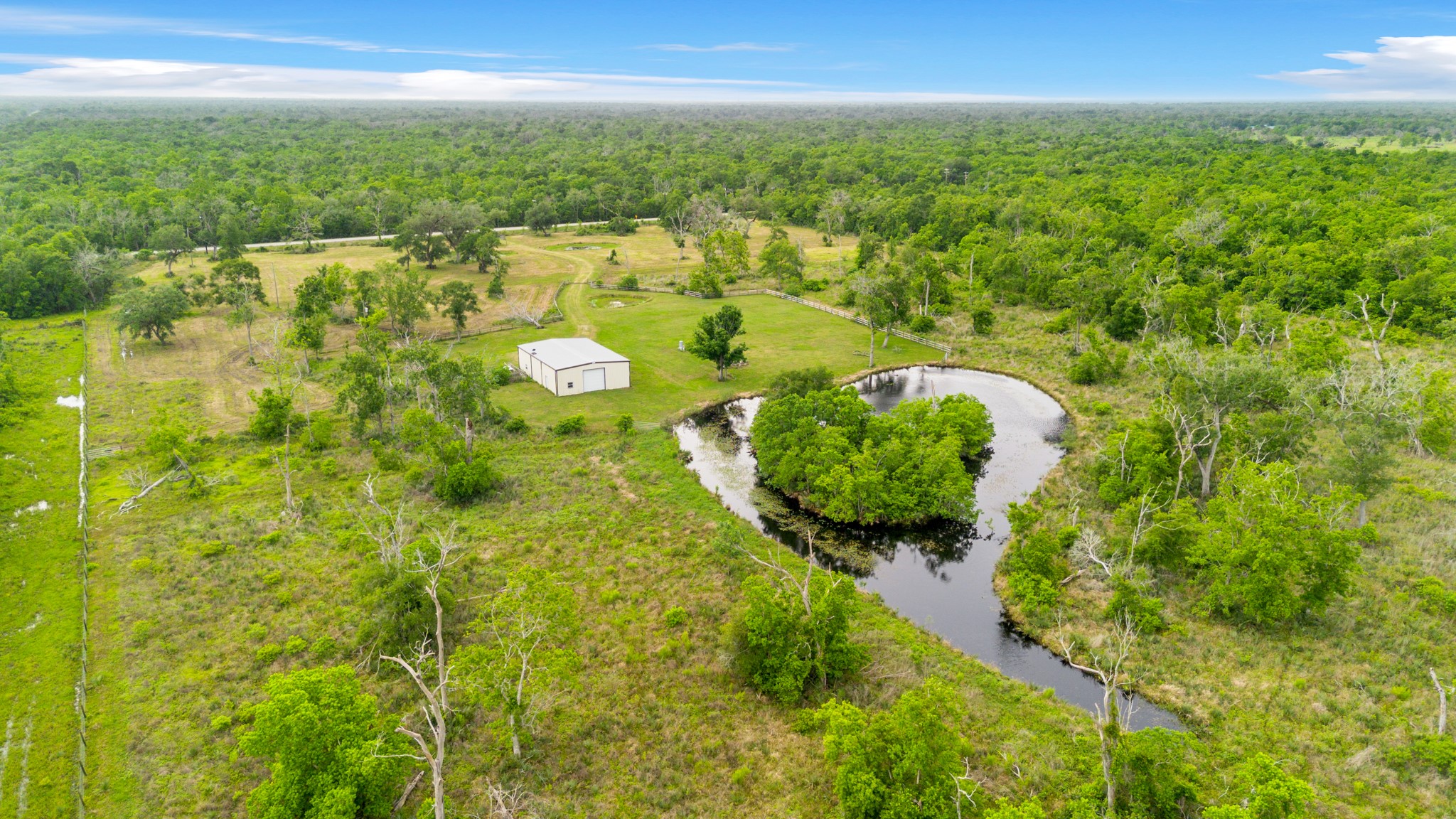 14067 County Road 809 Sweeny, TX 77480 - Photo 7 of 12 a view of a lake with a city