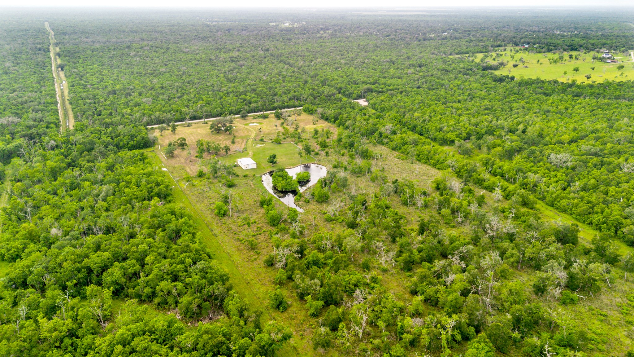 14067 County Road 809 Sweeny, TX 77480 - Photo 8 of 12 a view of a field with an ocean