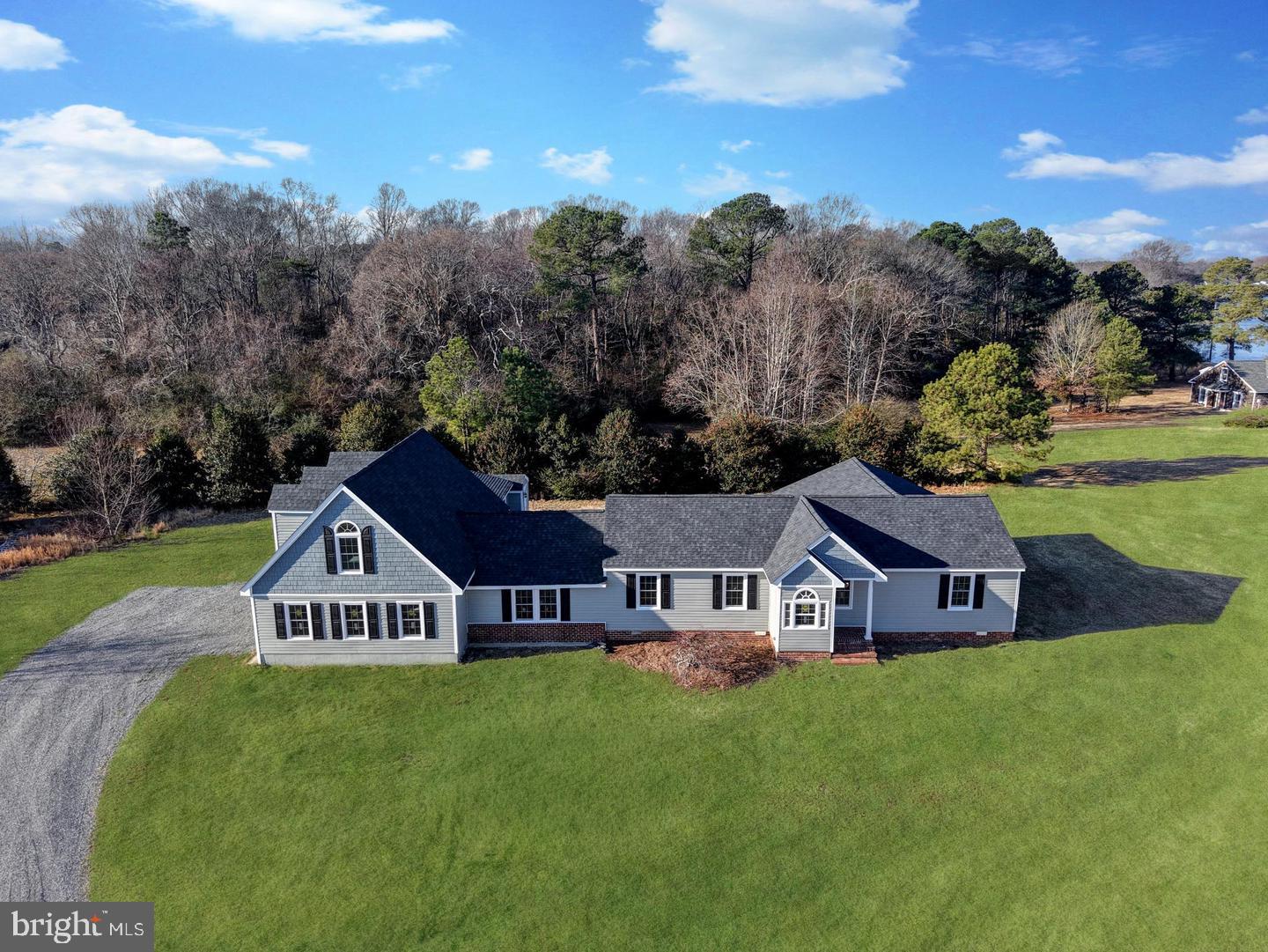 2755 Sunnybank Road Reedville, VA 22539 - Photo 2 of 57 Charming home nestled in serene greenery.