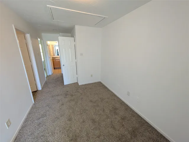 an empty room with a mirror