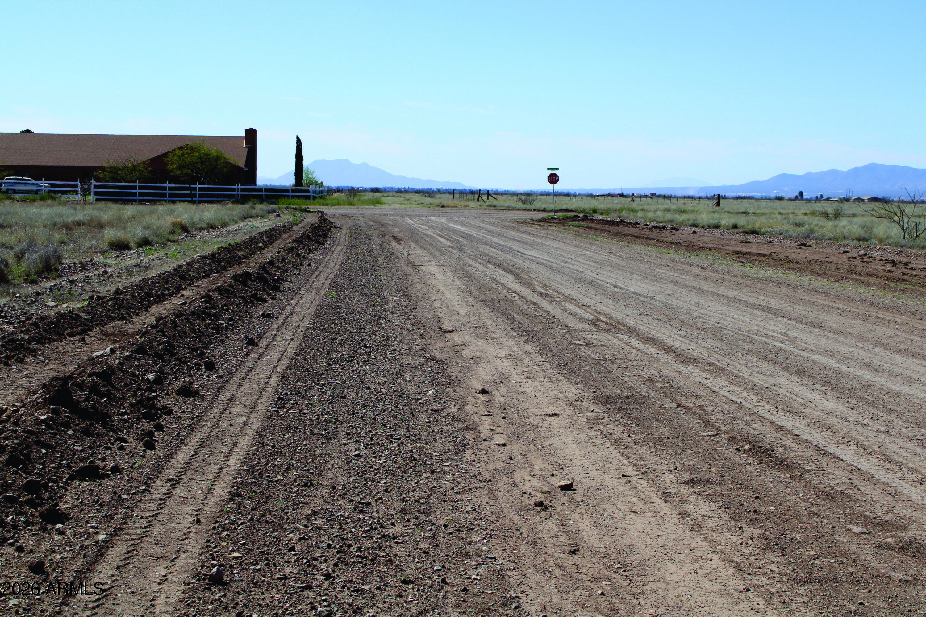 1.38-acres North San Louis Rey Drive, Unit 305 Douglas, AZ 85607 - Photo 3 of 4 a view of a dry yard with wooden fence