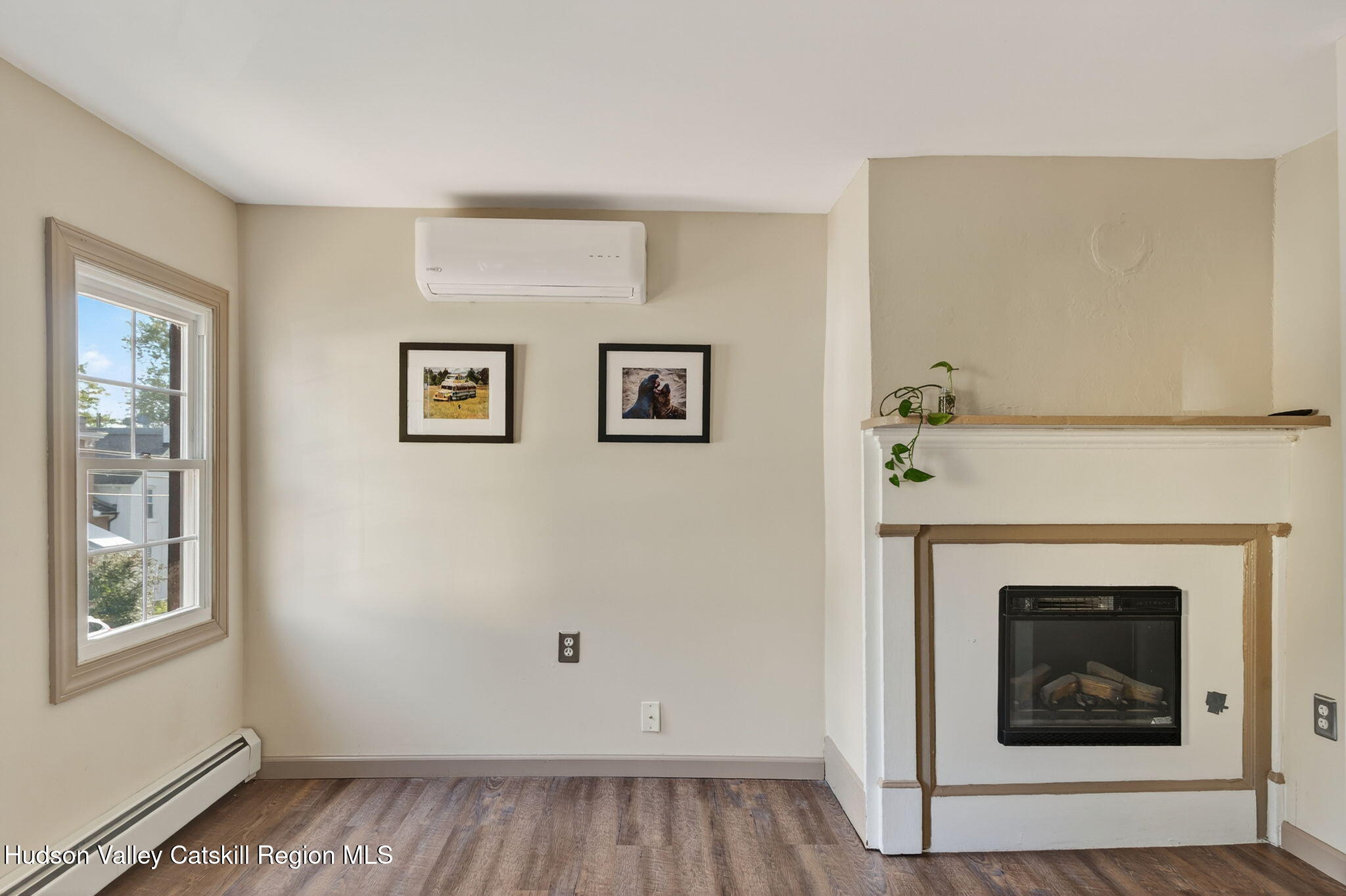 89 Spring Street Kingston, NY 12401 - Photo 14 of 24 a view of a livingroom with an empty space and a fireplace