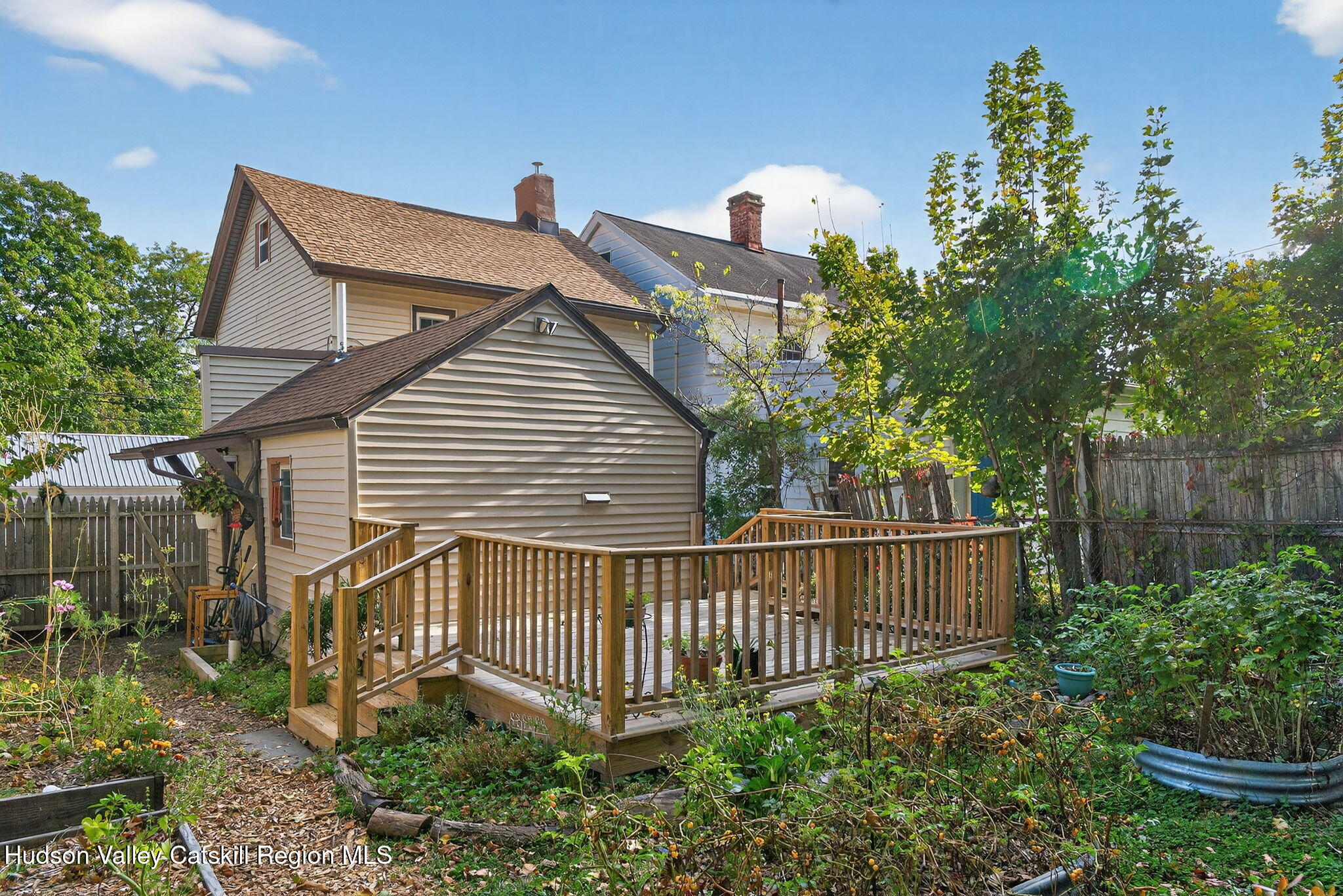 89 Spring Street Kingston, NY 12401 - Photo 23 of 24 a view of a house with a small yard and plants