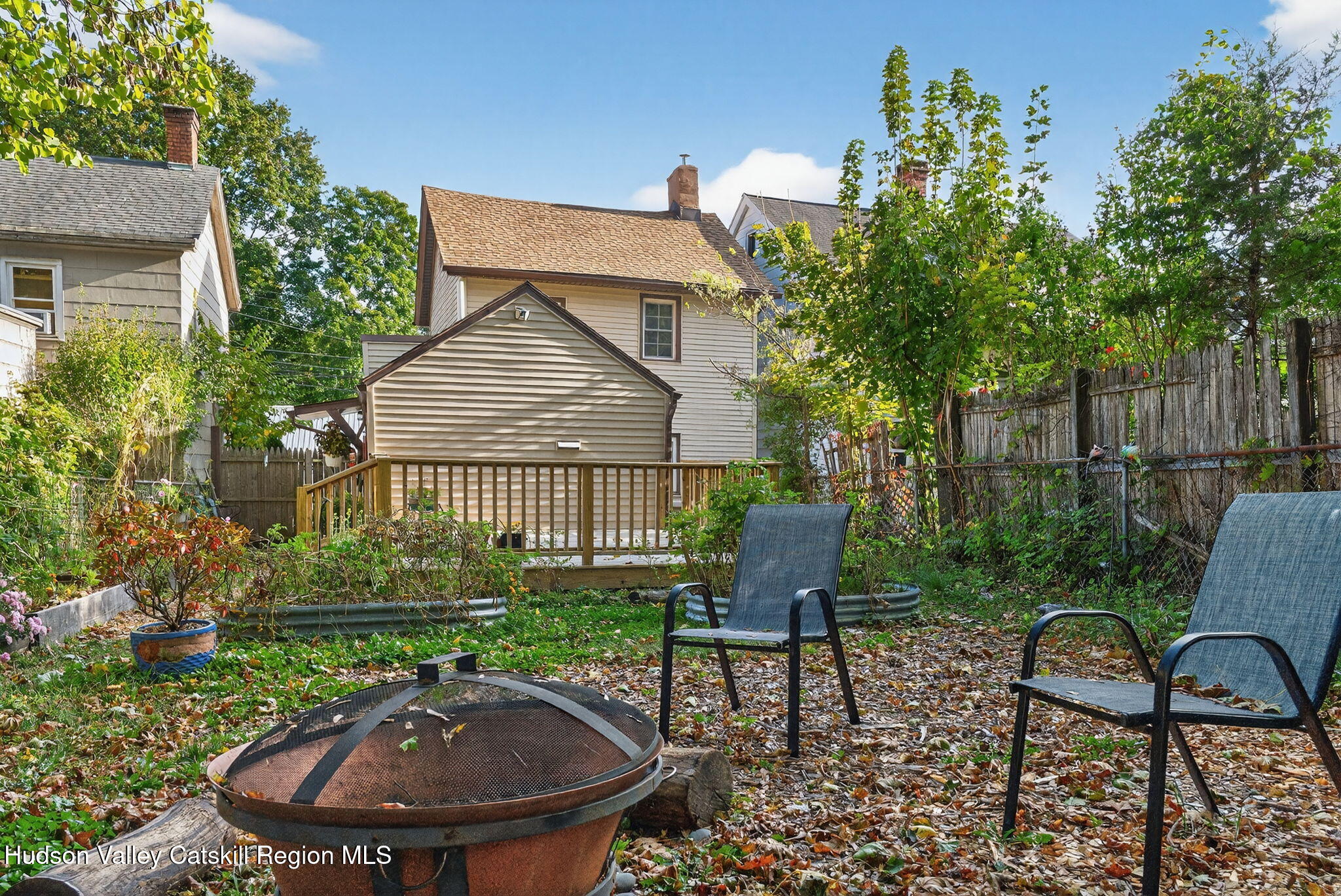 89 Spring Street Kingston, NY 12401 - Photo 24 of 24 a backyard of a house with table and chairs