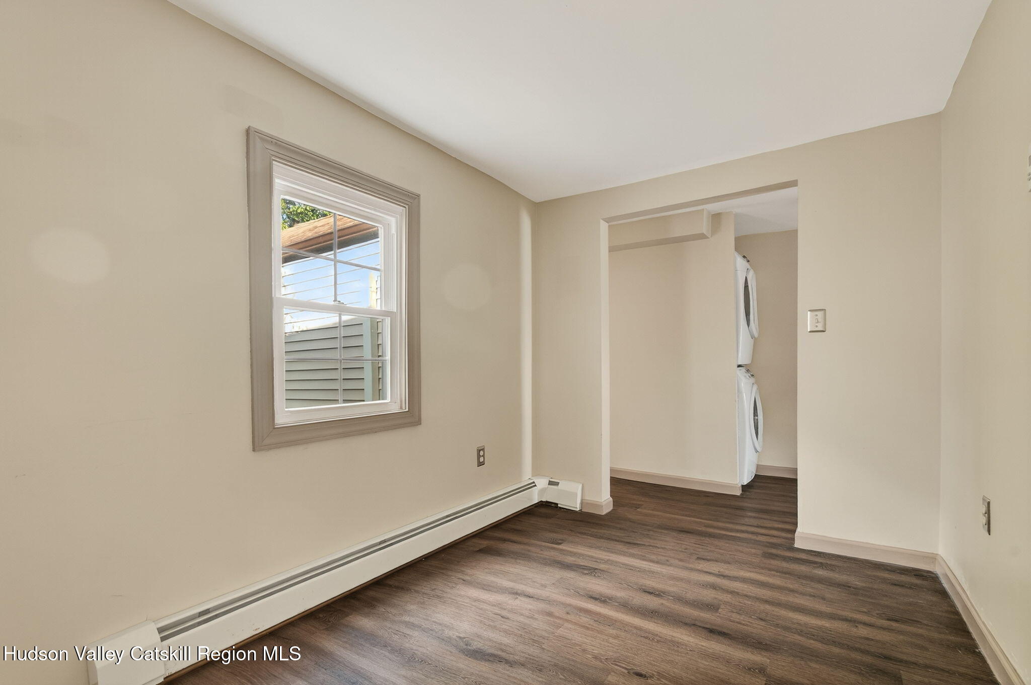 89 Spring Street Kingston, NY 12401 - Photo 10 of 24 an empty room with wooden floor and windows