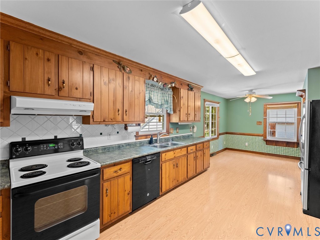 3524 Ludgate Road Chester, VA 23831 - Photo 17 of 44 Kitchen featuring wood cabinetry, white tiled back