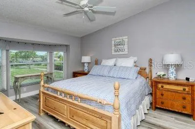 a bed room with a bed and a window
