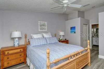 a bedroom with a bed and a dresser in it