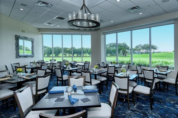 a view of a dining room with furniture window and outside view
