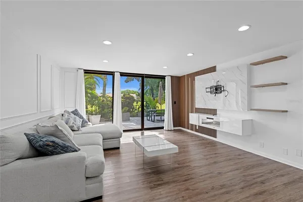 a living room with furniture and a large window