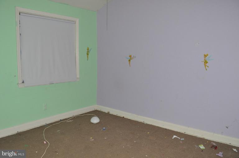 1023 Middlesex Road Essex, MD 21221 - Photo 5 of 7 an empty room with a fan