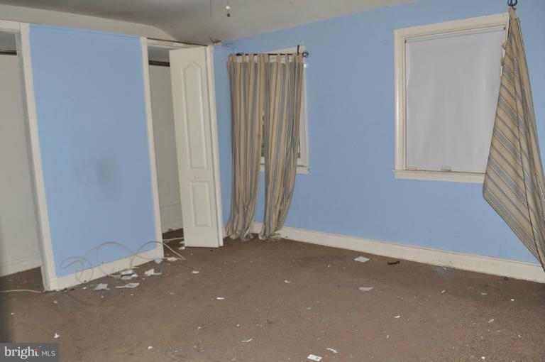 1023 Middlesex Road Essex, MD 21221 - Photo 6 of 7 an empty room with windows