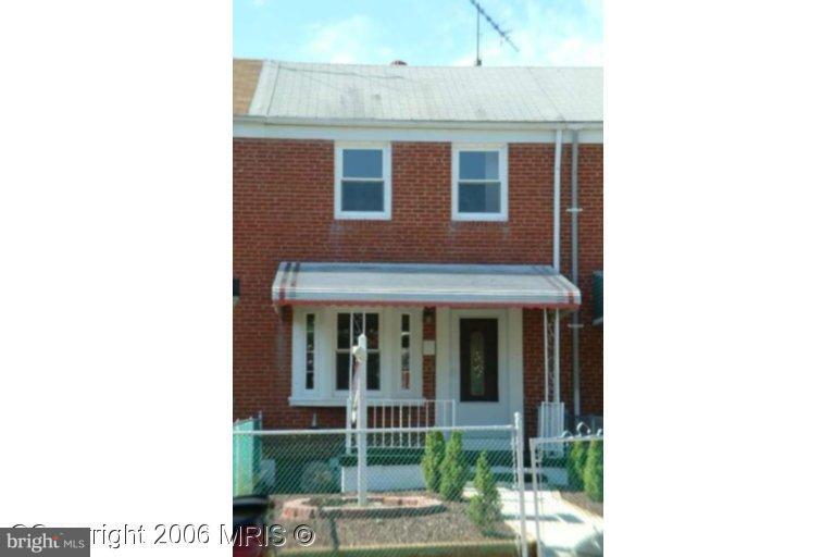 1023 Middlesex Road Essex, MD 21221 - Photo 7 of 7 a brick house with a large windows
