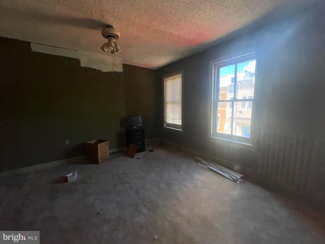 an empty room with windows