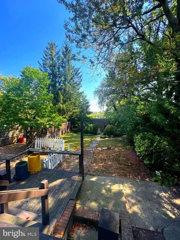 a view of a yard with swimming pool