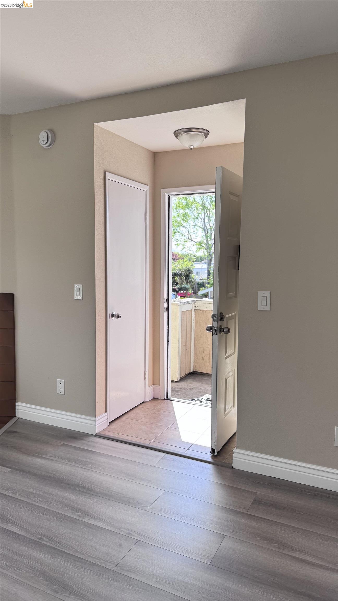 23 Raintree Court, Unit 15 Hayward, CA 94544 - Photo 12 of 16 Foyer featuring baseboards and light wood-type flooring