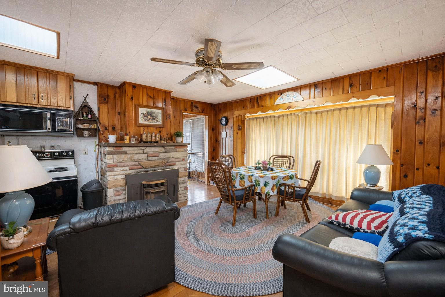 682 Marsh Hill Road McHenry, MD 21541 - Photo 12 of 40 a living room with furniture and a fireplace