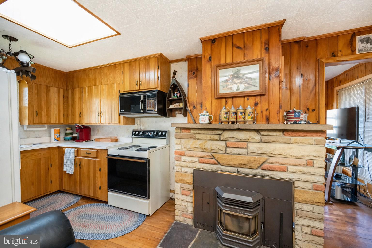 682 Marsh Hill Road McHenry, MD 21541 - Photo 14 of 40 a kitchen with stainless steel appliances a stove a sink and a microwave